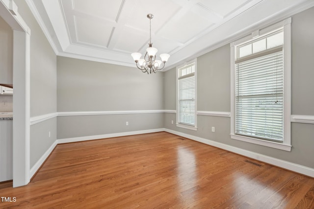 105 Bagley Ln, Dunn, NC 28334 - empty room with coffered ceiling, a chandelier, wood finished floors, baseboards, and ornamental molding