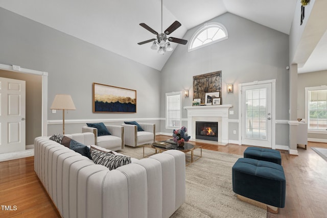 105 Bagley Ln, Dunn, NC 28334 - living area with a ceiling fan, high vaulted ceiling, wood finished floors, and a fireplace with flush hearth