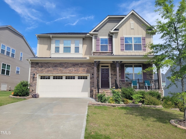 241 Fishburn Dr, Apex, NC 27523 - craftsman house with board and batten siding, stone siding, an attached garage, concrete driveway, and a front lawn