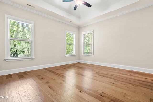 192 Glenpark Pl, Cary, NC 27511 - unfurnished room featuring hardwood / wood-style floors, a ceiling fan, baseboards, ornamental molding, and a raised ceiling