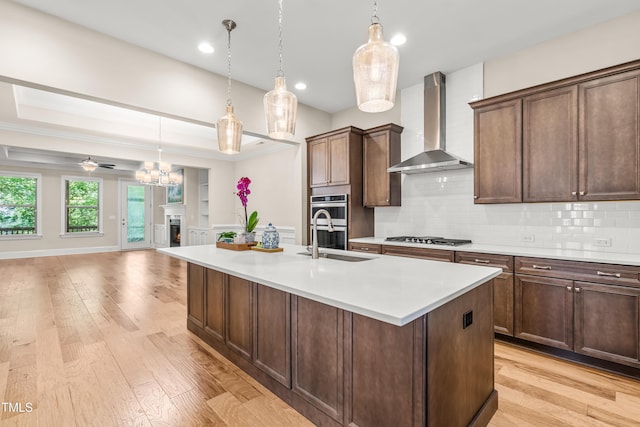 192 Glenpark Pl, Cary, NC 27511 - kitchen with wall chimney exhaust hood, a sink, stainless steel appliances, tasteful backsplash, and recessed lighting