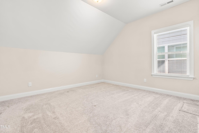 192 Glenpark Pl, Cary, NC 27511 - additional living space with lofted ceiling, baseboards, and carpet floors