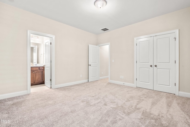 192 Glenpark Pl, Cary, NC 27511 - unfurnished bedroom featuring light carpet, baseboards, a closet, and ensuite bathroom