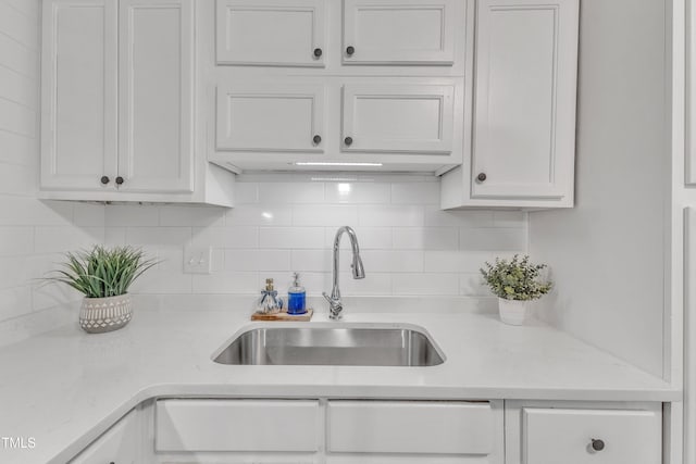 501 Gooseneck Dr Unit B2, Cary, NC 27513 - kitchen with a sink, light countertops, white cabinetry, and decorative backsplash