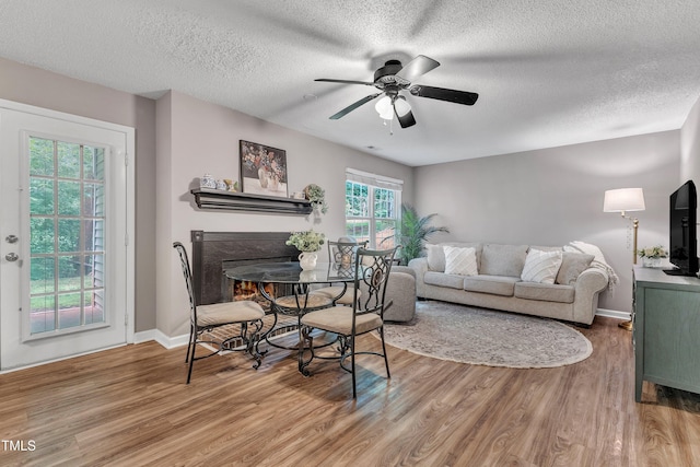 501 Gooseneck Dr Unit B2, Cary, NC 27513 - dining space with wood finished floors, a ceiling fan, a textured ceiling, and baseboards