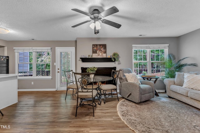 501 Gooseneck Dr Unit B2, Cary, NC 27513 - living room with a textured ceiling, wood finished floors, a ceiling fan, and baseboards