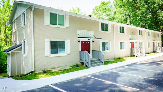 800 Pritchard Avenue Extension Unit H4, Chapel Hill, NC 27516 - view of front of property with brick siding and uncovered parking