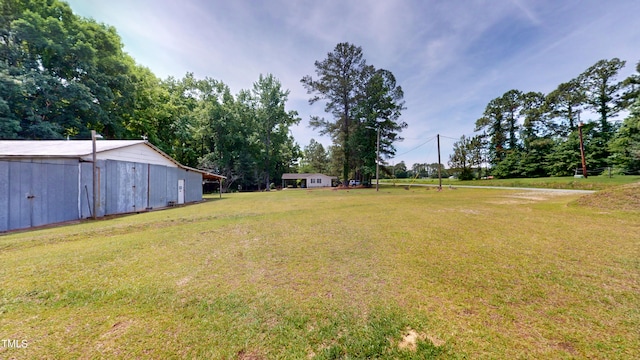 4509 Stevens Chapel Rd, Smithfield, NC 27577 - view of green lawn featuring an outbuilding and an outdoor structure