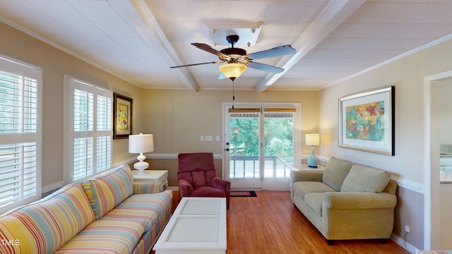 4509 Stevens Chapel Rd, Smithfield, NC 27577 - living area featuring crown molding, wood finished floors, plenty of natural light, a ceiling fan, and beamed ceiling