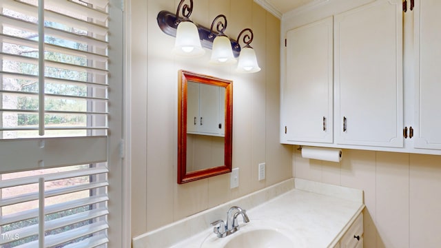 4509 Stevens Chapel Rd, Smithfield, NC 27577 - bathroom with vanity, a decorative wall, and crown molding