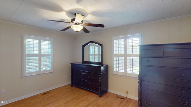 4509 Stevens Chapel Rd, Smithfield, NC 27577 - unfurnished bedroom with ornamental molding, light wood-style floors, baseboards, and a ceiling fan