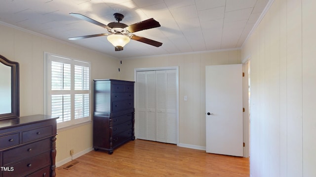 4509 Stevens Chapel Rd, Smithfield, NC 27577 - unfurnished bedroom with light wood-type flooring, crown molding, a closet, baseboards, and ceiling fan
