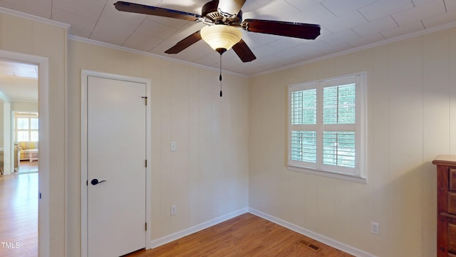 4509 Stevens Chapel Rd, Smithfield, NC 27577 - empty room with ornamental molding, plenty of natural light, light wood-style flooring, ceiling fan, and baseboards
