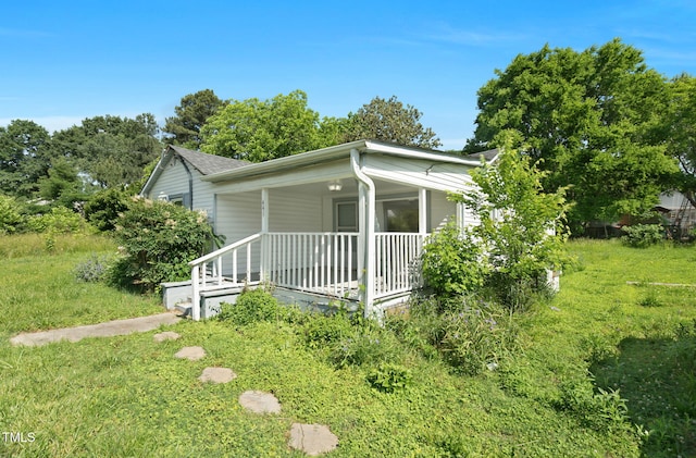 441 Cedar St, Henderson, NC 27536 - view of front facade featuring covered porch