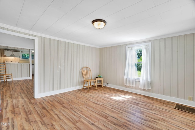 441 Cedar St, Henderson, NC 27536 - sitting room with wood finished floors, crown molding, and baseboards