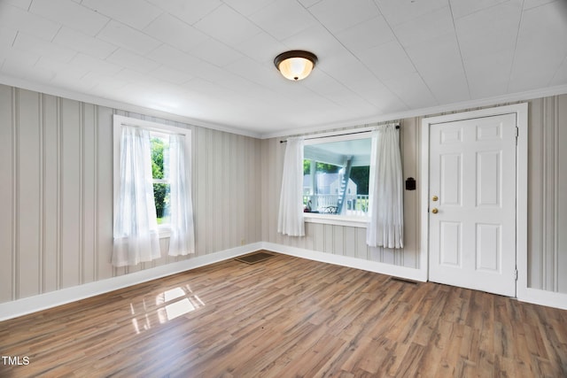 441 Cedar St, Henderson, NC 27536 - spare room featuring wood finished floors, ornamental molding, and baseboards