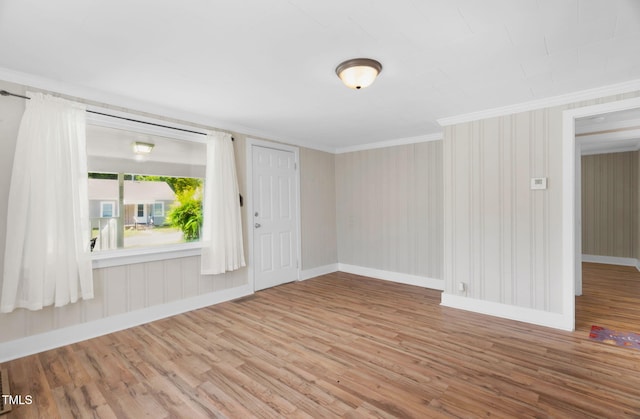 441 Cedar St, Henderson, NC 27536 - empty room featuring ornamental molding, baseboards, and wood finished floors