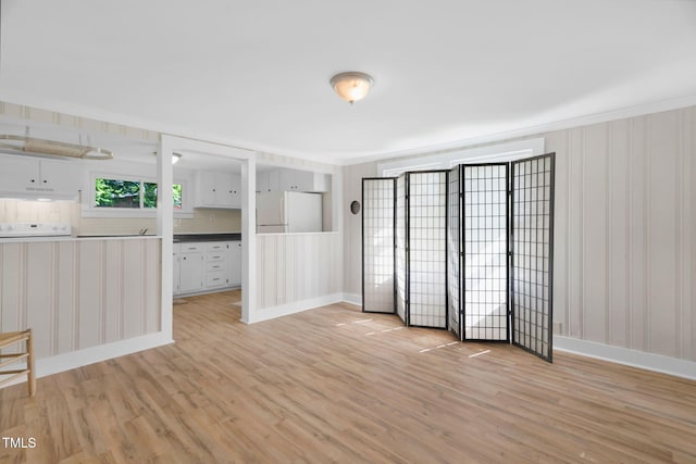 441 Cedar St, Henderson, NC 27536 - unfurnished room with light wood finished floors, crown molding, and baseboards