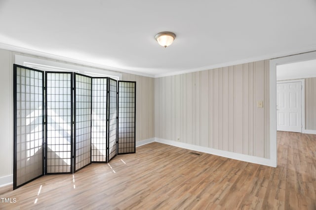 441 Cedar St, Henderson, NC 27536 - spare room with light wood finished floors, crown molding, and baseboards