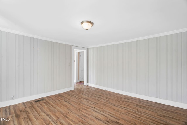441 Cedar St, Henderson, NC 27536 - empty room with wood finished floors, crown molding, and baseboards