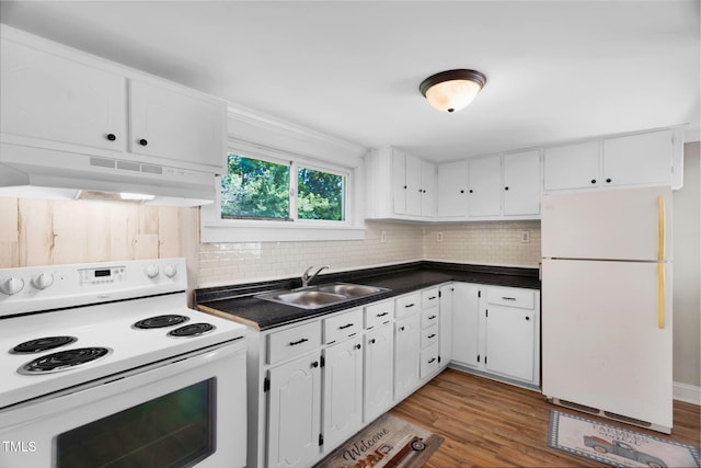 441 Cedar St, Henderson, NC 27536 - kitchen with white appliances, a sink, under cabinet range hood, dark countertops, and white cabinetry