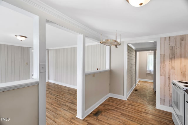 441 Cedar St, Henderson, NC 27536 - hall with crown molding, wood finished floors, and baseboards