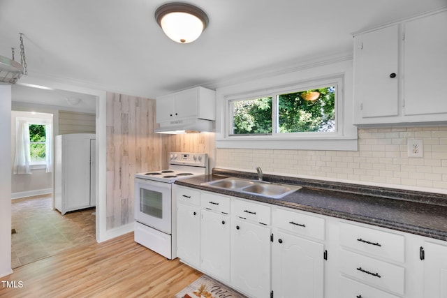 441 Cedar St, Henderson, NC 27536 - kitchen with electric range, a sink, under cabinet range hood, dark countertops, and ornamental molding