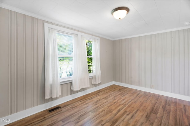 441 Cedar St, Henderson, NC 27536 - spare room with wood finished floors, ornamental molding, and baseboards