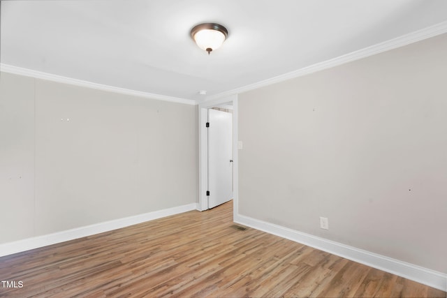441 Cedar St, Henderson, NC 27536 - empty room featuring crown molding, light wood-style floors, and baseboards