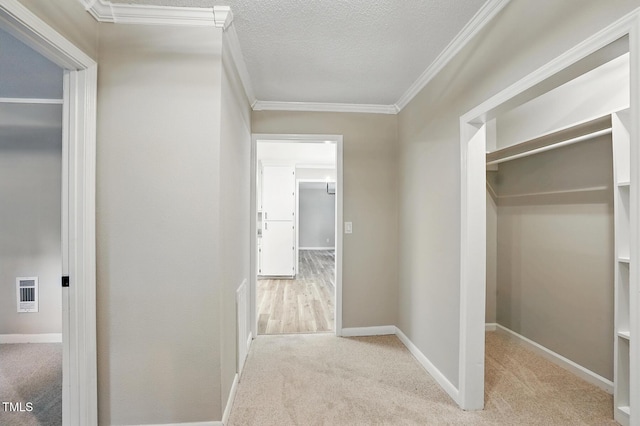 3916 W Allen, Raleigh, NC 27603 - hallway featuring carpet floors, crown molding, a textured ceiling, and baseboards