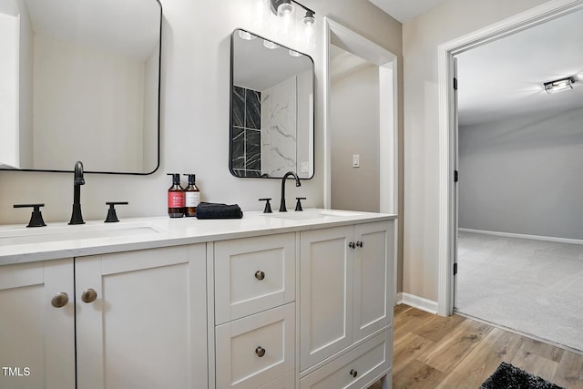 3916 W Allen, Raleigh, NC 27603 - full bath featuring double vanity, wood finished floors, and baseboards