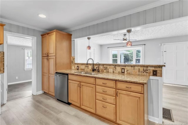 5409 S Sumac Cir, Fayetteville, NC 28304 - kitchen with stainless steel dishwasher, a sink, light wood-type flooring, a peninsula, and backsplash