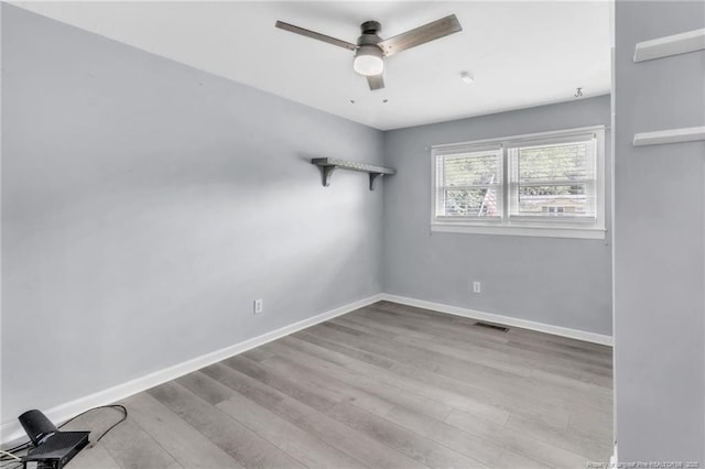 5409 S Sumac Cir, Fayetteville, NC 28304 - empty room featuring wood finished floors, ceiling fan, and baseboards