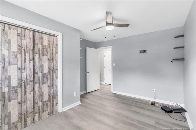 5409 S Sumac Cir, Fayetteville, NC 28304 - unfurnished bedroom featuring wood finished floors, baseboards, and ceiling fan