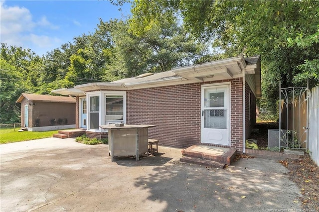 5409 S Sumac Cir, Fayetteville, NC 28304 - view of front of home featuring brick siding and a patio area