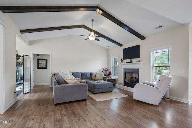 7055 NC-242, Dunn, NC 28334 - living area with wood finished floors, a fireplace with raised hearth, a ceiling fan, and baseboards