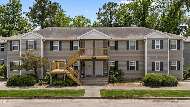 5134 Greenville Loop Rd Apt D, Wilmington, NC 28409 - view of front of property featuring roof with shingles and stairs