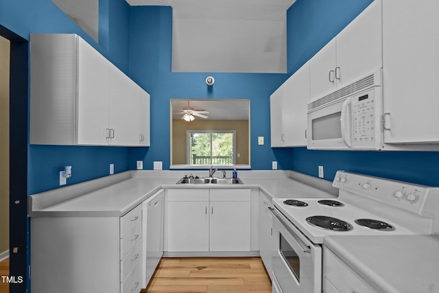5134 Greenville Loop Rd Apt D, Wilmington, NC 28409 - kitchen with white appliances, a sink, light countertops, ceiling fan, and light wood-style floors