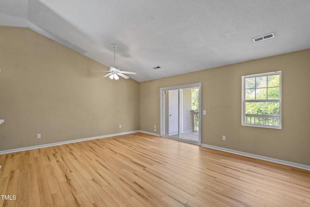 5134 Greenville Loop Rd Apt D, Wilmington, NC 28409 - spare room featuring lofted ceiling, light wood-style flooring, a ceiling fan, and baseboards