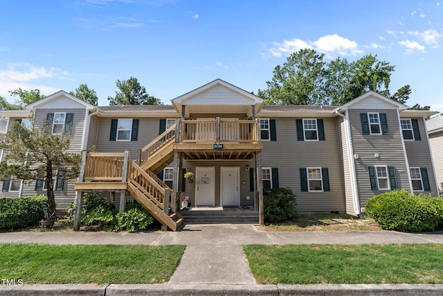 5134 Greenville Loop Rd Apt D, Wilmington, NC 28409 - townhome / multi-family property featuring stairs and a wooden deck
