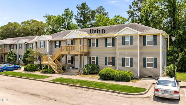 5134 Greenville Loop Rd Apt D, Wilmington, NC 28409 - view of property with crawl space, stairway, and a shingled roof