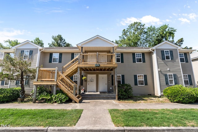 5134 Greenville Loop Rd Apt D, Wilmington, NC 28409 - townhome / multi-family property featuring stairs and a deck