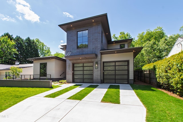 2805 Van Dyke Ave, Raleigh, NC 27607 - contemporary home featuring concrete driveway, brick siding, and a garage