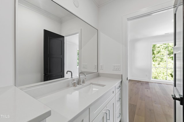 2805 Van Dyke Ave, Raleigh, NC 27607 - bathroom featuring vanity, wood-type flooring, and ornamental molding
