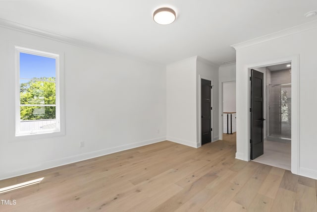 2805 Van Dyke Ave, Raleigh, NC 27607 - unfurnished bedroom featuring ornamental molding, light wood-type flooring, and baseboards