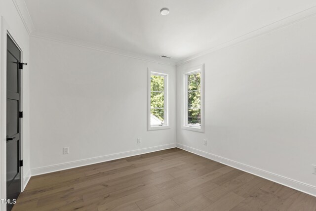 2805 Van Dyke Ave, Raleigh, NC 27607 - spare room featuring ornamental molding, wood finished floors, and baseboards