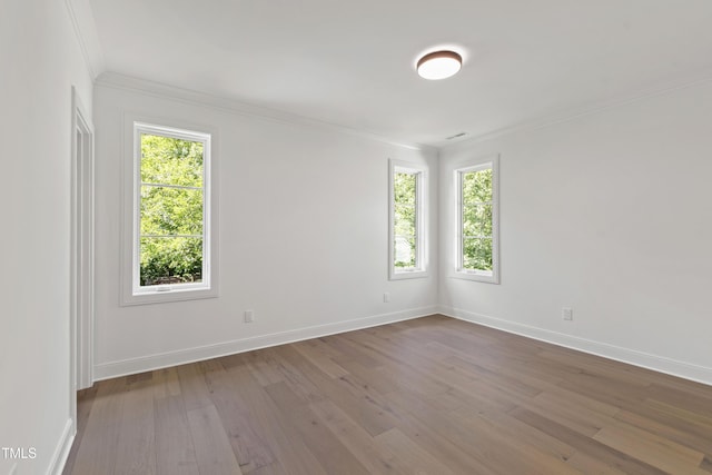 2805 Van Dyke Ave, Raleigh, NC 27607 - unfurnished room with ornamental molding, hardwood / wood-style floors, and baseboards
