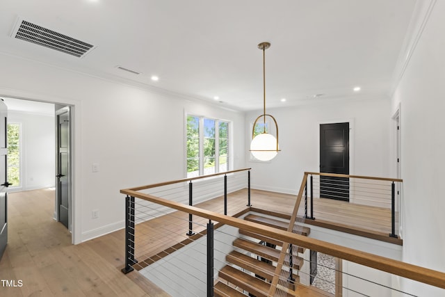 2805 Van Dyke Ave, Raleigh, NC 27607 - hall featuring an upstairs landing, crown molding, plenty of natural light, light wood-style flooring, and recessed lighting