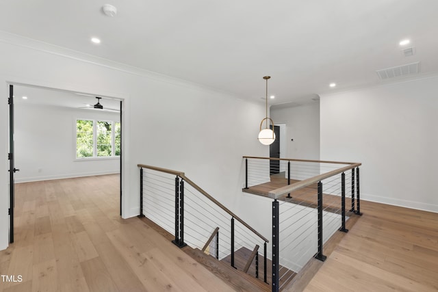 2805 Van Dyke Ave, Raleigh, NC 27607 - corridor with an upstairs landing, crown molding, light wood-type flooring, recessed lighting, and baseboards