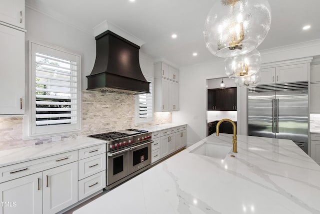2805 Van Dyke Ave, Raleigh, NC 27607 - kitchen featuring high end appliances, custom range hood, a sink, decorative backsplash, and crown molding